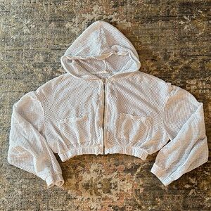 Fishnet mesh cropped FP movement hoodie.